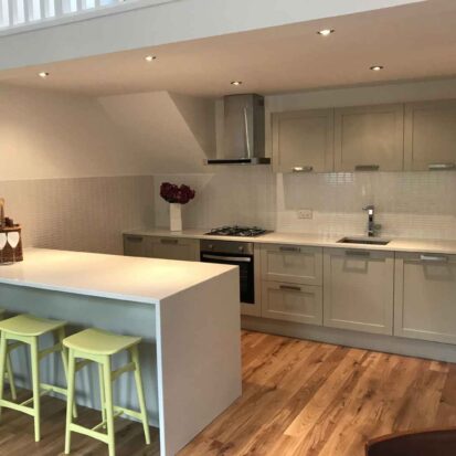 White quartz kitchen and granite upstands