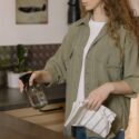 Woman cleaning granite worktop