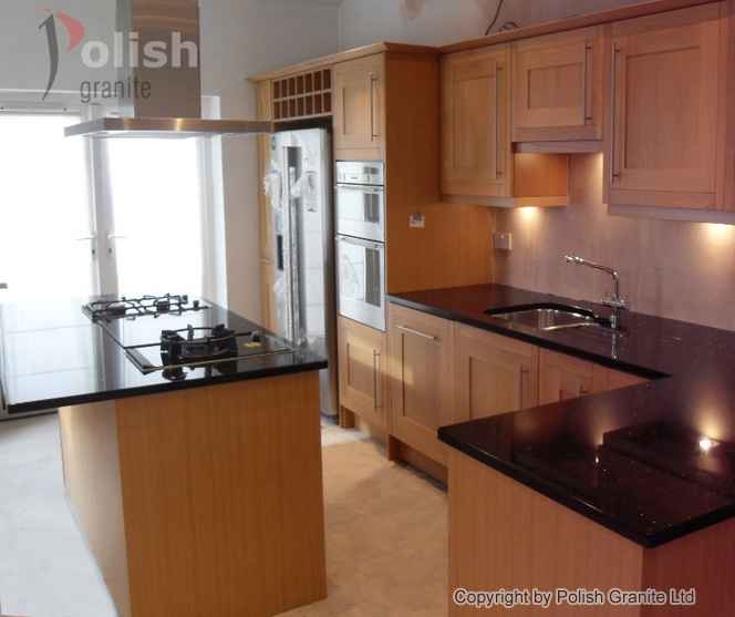 Kitchen island and absolute black worktops