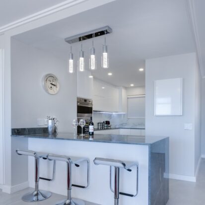 grey granite worktops and white kitchen