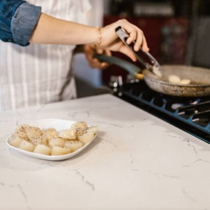 Cooking in a kitchen with granite worktops