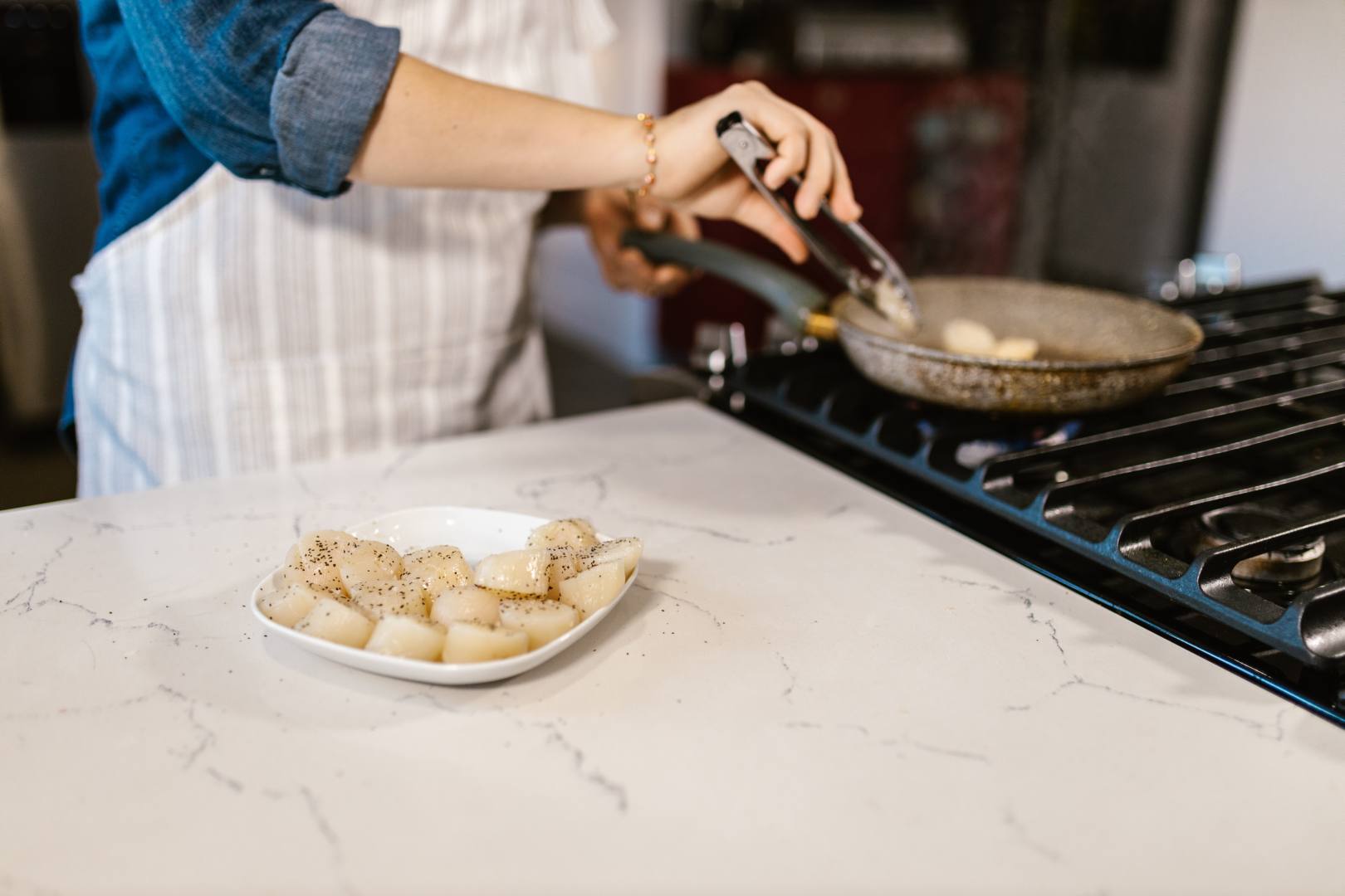 Cooking in a kitchen with granite worktops