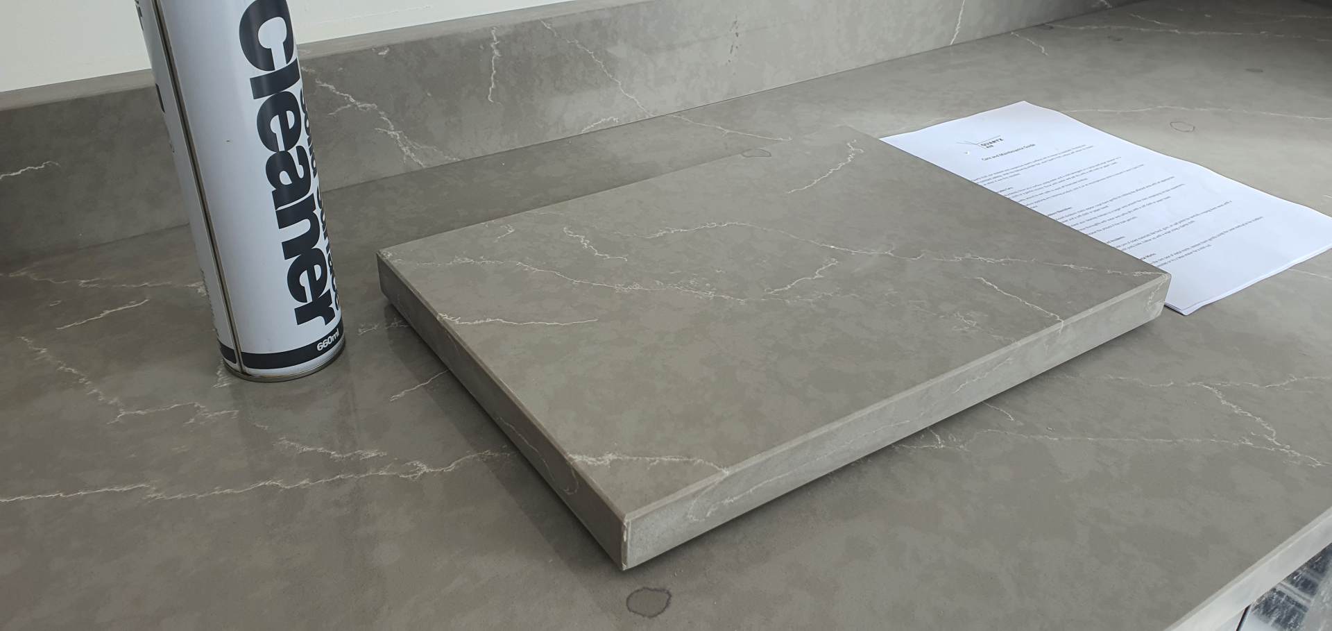 stone chopping board from quartz grey and cleaning spray