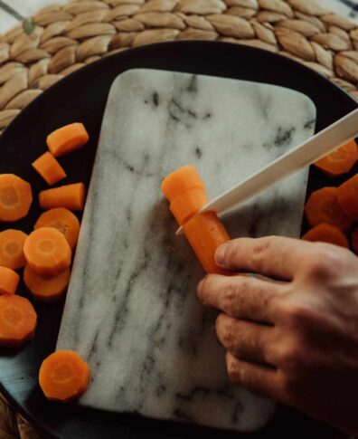 carrot cut on a cutting board from stone