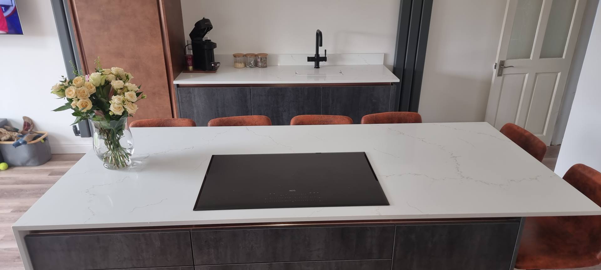 quartz worktops in a black kitchen setting